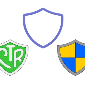 May include: Three shield designs. The first is a simple outline of a shield in blue. The second is a green shield with a white outline and the letters CTR inside. The third is a gray shield with a yellow and blue checkerboard pattern.