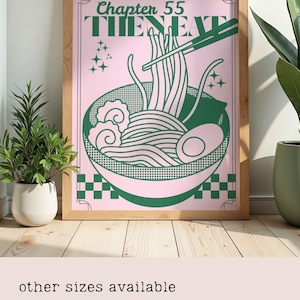 May include: A framed art print featuring a green and pink ramen bowl illustration. The artwork includes the text "Chapter 55 THE NEXT" at the top. The ramen bowl design includes noodles, an egg, and chopsticks. The frame is made of light-colored wood.
