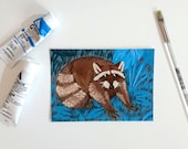 Raccoon in a vegetal background, postcard A6-format