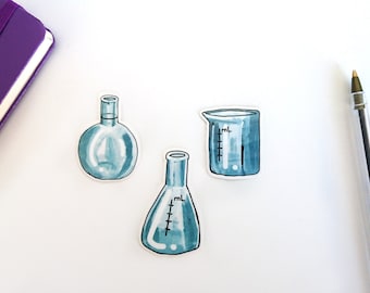 May include: Three blue glass laboratory beakers with markings. The beakers are on a white surface.