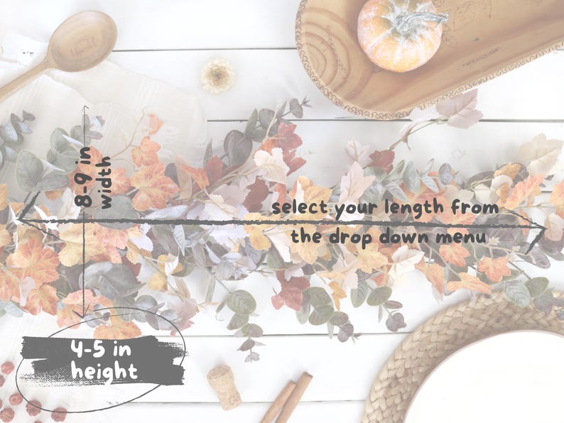 Pode incluir: Uma guirlanda com tema de outono apresentando uma mistura de folhas laranja, amarelas e marrons com ramos de eucalipto verde. A guirlanda mede 20-23 cm de largura e 10-13 cm de altura. O texto diz: select your length from the drop down menu.