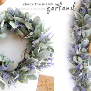 May include: A decorative wreath and garland featuring faux lavender and silvery-green leaves. The wreath is circular, and the garland is linear. The image includes the text "check the matching garland" and "SUZYSWAY.ETSY.COM".