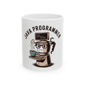 May include: White ceramic mug with the text "JAVA PROGRAMMER" and a cartoon coffee maker character. The character wears glasses and holds a cup of coffee and a keyboard. The coffee maker has a small screen with code.