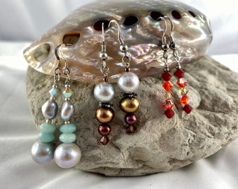 Three pairs drop earrings featuring pearls,amazonite and Swarovski crystal on sterling silver hooks. Stock clearance.