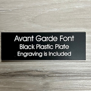 May include: Black plastic nameplate with white text that reads "Avant Garde Font Black Plastic Plate Engraving is Included".