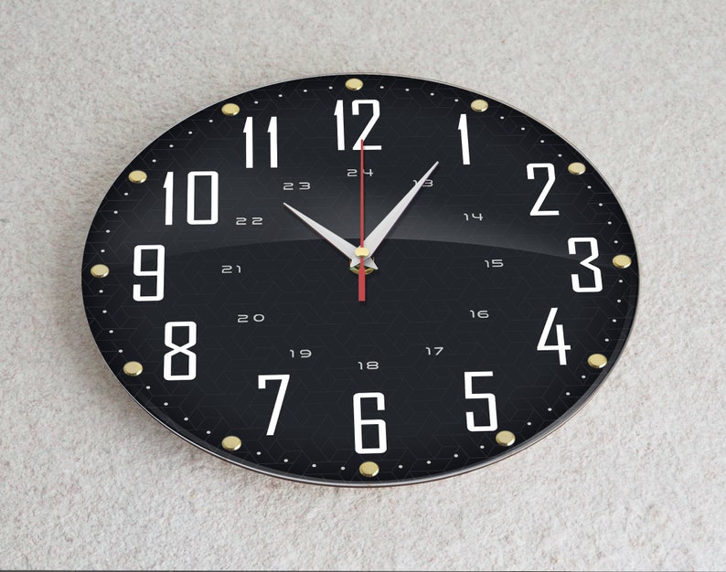May include: A black clock with white numbers and gold accents. The clock face has a black background with a white grid pattern. The clock hands are white with a red second hand.