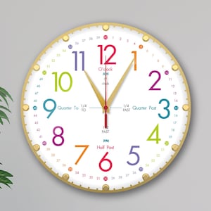 May include: A white analog clock with a gold rim and colorful numbers. The clock face has a white background with black markings for the hours and minutes. The numbers are in a rainbow pattern, with each number a different color. The clock hands are gold.