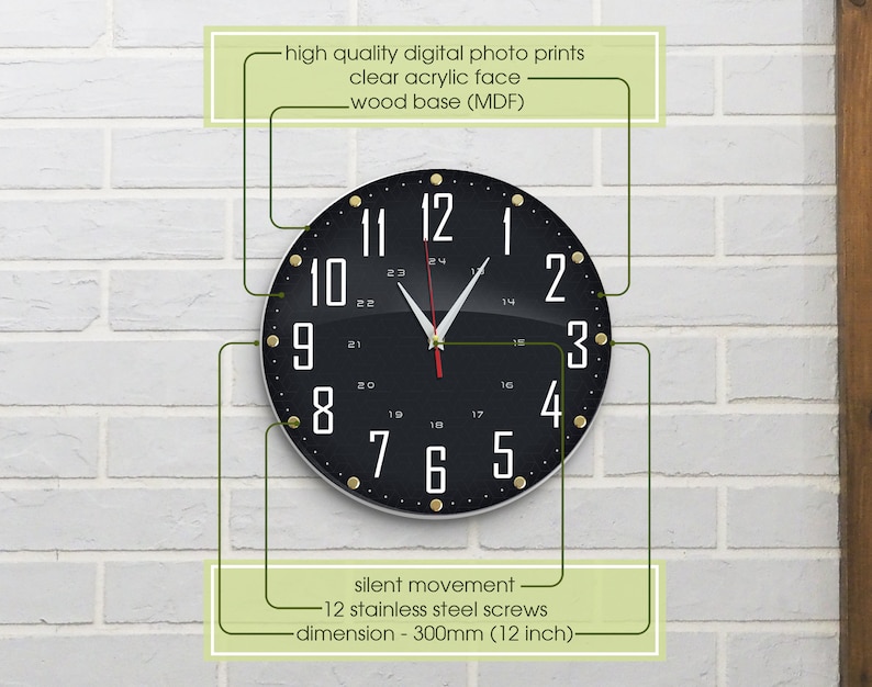 May include: Black and white clock with gold accents and a clear acrylic face. The clock is 12 inches in diameter and has a silent movement. The clock is mounted on a white brick wall.