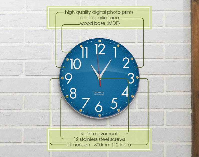 May include: A blue and white quartz wall clock with gold accents. The clock face is made of clear acrylic and has a wood base. The clock is 12 inches in diameter and has a silent movement.