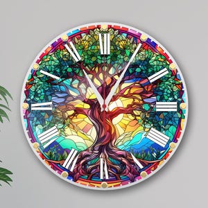May include: A colorful stained glass clock featuring a tree of life design with Roman numeral hour markers. The clock face is round and has a white background.