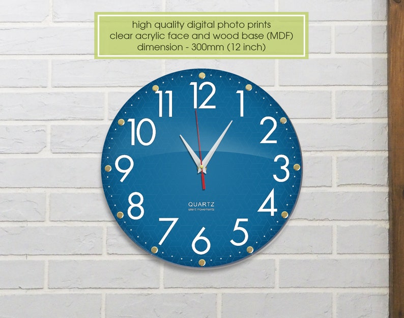 May include: A blue round clock with white numbers and gold accents. The clock is 12 inches in diameter and has a quartz movement.