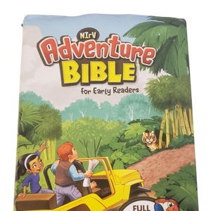 May include: The cover of a children's book, "Adventure Bible for Early Readers", shows a yellow jeep with two children and a tiger in a jungle. A parrot sits on a branch. The cover states "Full Color Inside!" and "#1 Bible for Kids."