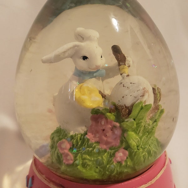 Easter Bunny white bunny decorating easter egg glitter globe glass with wood base egg shaped snow globe