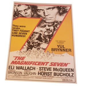 May include: A vintage movie poster for The Magnificent Seven featuring a large yellow number seven graphic, black and white portraits of actors, and the text: They were seven... THEY FOUGHT LIKE SEVEN HUNDRED! YUL BRYNNER, ELI WALLACH, STEVE MCQUEEN.
