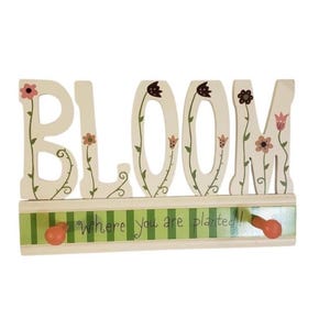 Bloom Where You Are Planted wall rack with pegs by Lori Siebert