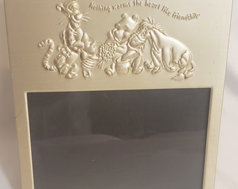 Disney silver toned picture frame Winnie the Pooh Tigger Piglet Eeyore with 5.25" W x 3.5" H opening Nothing warms the heart like friendship