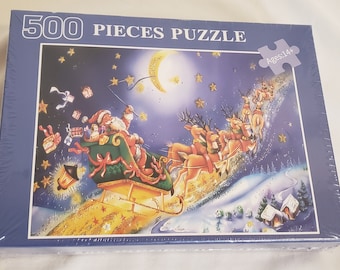 500-teiliges Puzzle: Weihnachtsmann in seinem Schlitten mit Rentier, das in den Himmel fliegt. Neues versiegeltes Weihnachtspuzzle