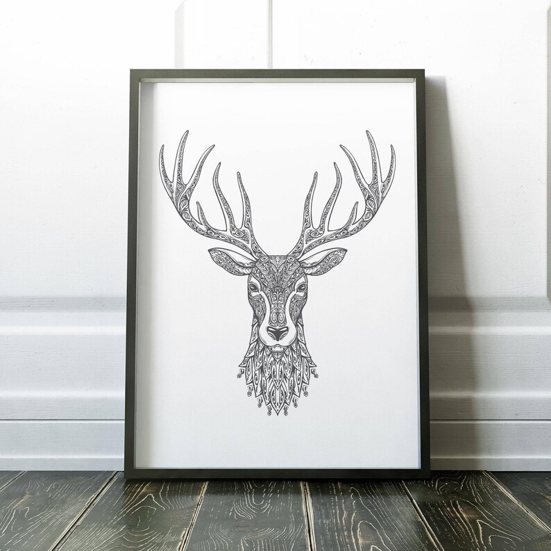 May include: Black and white line art print of a deer's head with intricate patterns in the antlers and fur. The print is framed in a black frame.