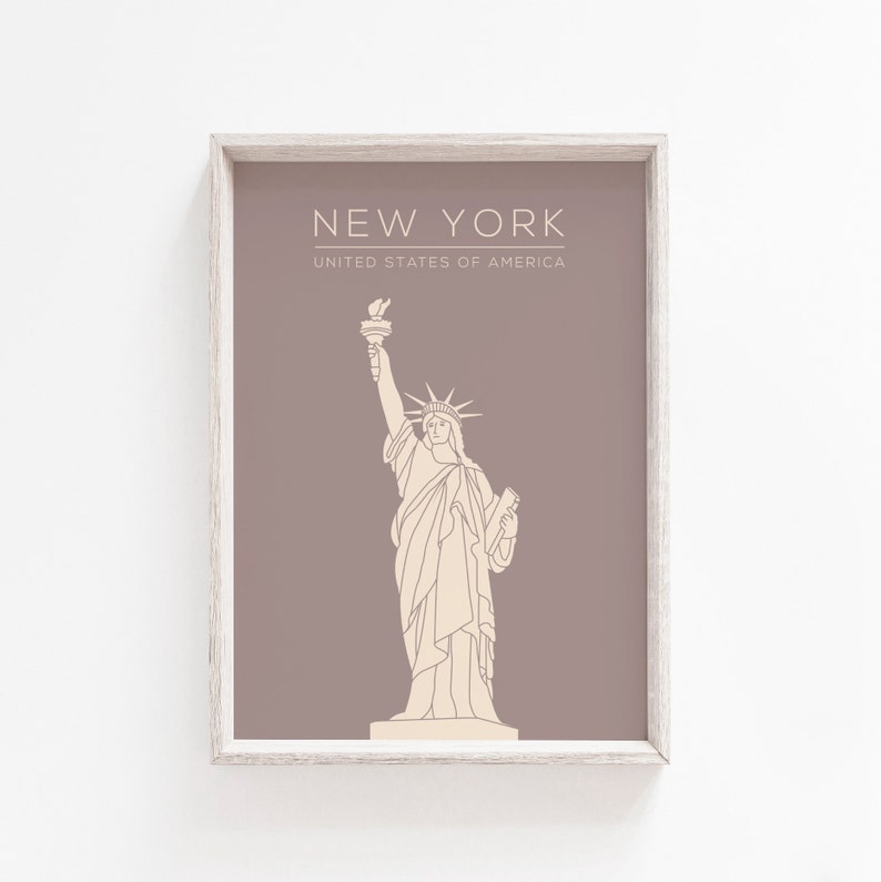 May include: A printable art print with a brown background and a white outline of the Statue of Liberty. The text "NEW YORK" and "UNITED STATES OF AMERICA" is printed in white at the top of the print.