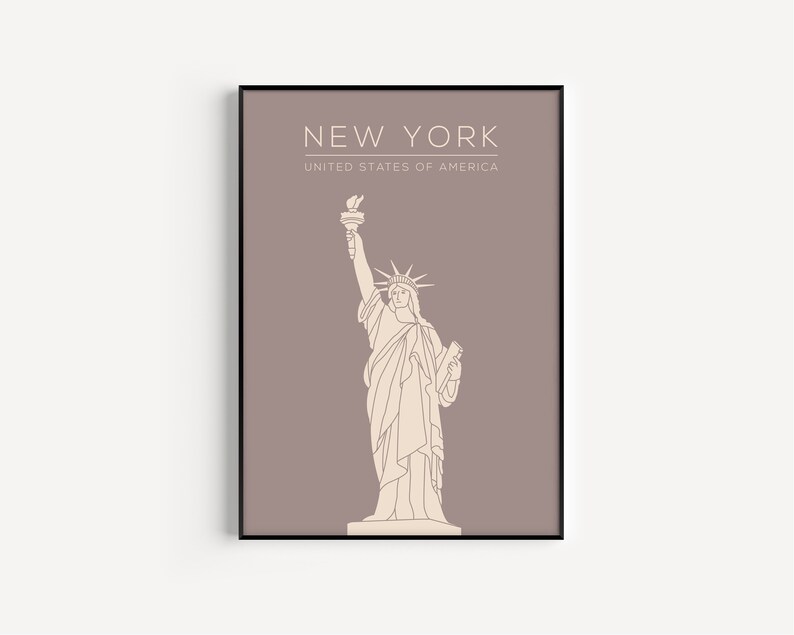 May include: A minimalist line art print of the Statue of Liberty in beige on a dusty rose background. The print has the text "NEW YORK" and "UNITED STATES OF AMERICA" in white.
