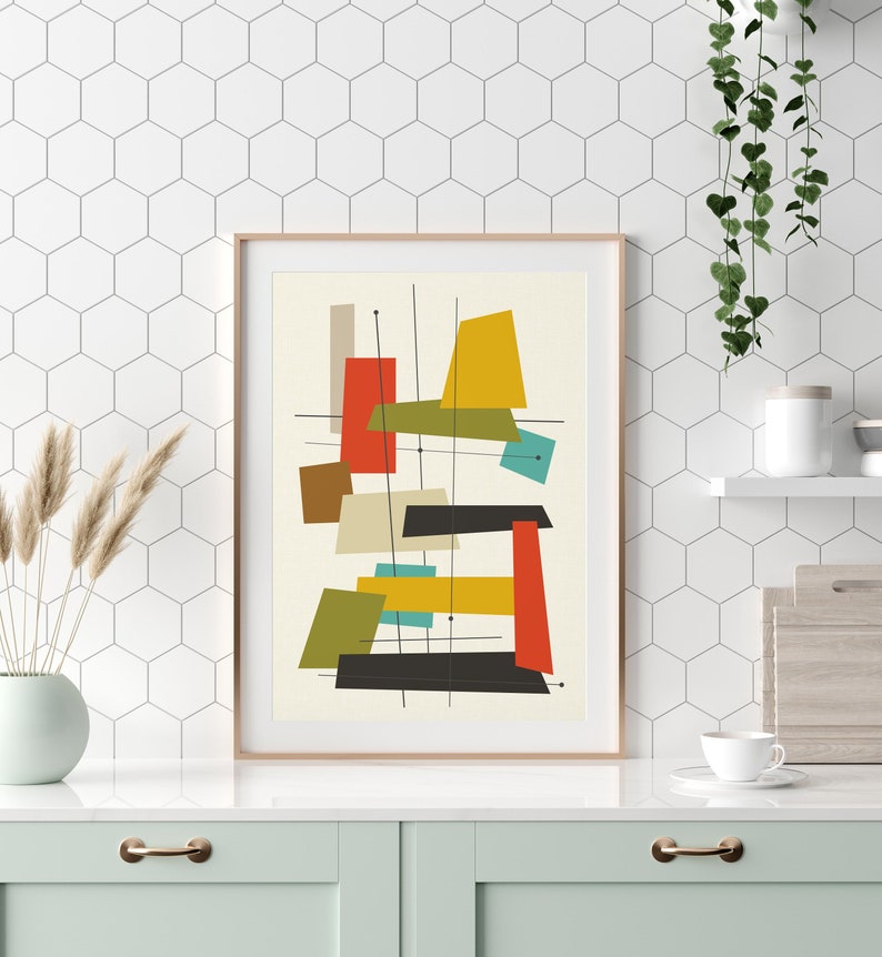May include: Abstract geometric art print with a white background and colourful shapes in red, yellow, green, blue, and brown. The shapes are arranged in a modern, mid-century style.