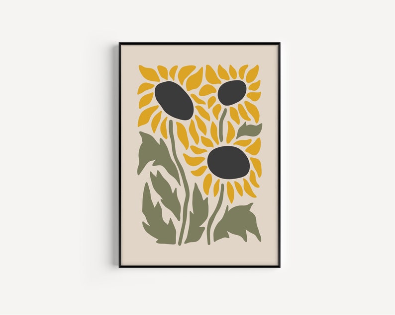 May include: A framed print featuring a stylized illustration of three sunflowers with yellow petals and black centers. The sunflowers are set against a cream background with green leaves.