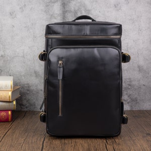 Sac à dos pour garçon avec poignée supérieure Sacs à dos pour ordinateur portable Sac à dos de voyage en cuir multi-poches pour homme Grand sac noir noir pour étudiants Cadeau de vacances pour petit ami