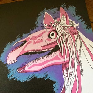 May include: A pink horse skull with a floral crown and white ribbons against a black background with blue and purple brushstrokes.