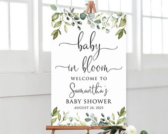 May include: A white sign with green watercolor leaves and the text "baby in bloom"  "Welcome to Samantha's Baby Shower August 24, 2023".