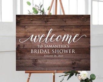 May include: A rustic wooden sign with the text "Welcome to Samantha's Bridal Shower" and the date "August 26, 2023".