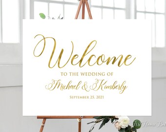 May include: White wedding welcome sign with gold lettering. The sign reads "Welcome to the wedding of Michael & Kimberly September 25, 2021".
