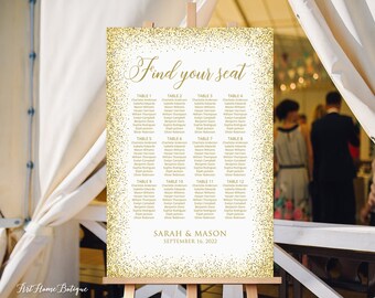 May include: Gold glitter wedding seating chart with the text "Find your seat" and "Sarah & Mason September 16, 2022".