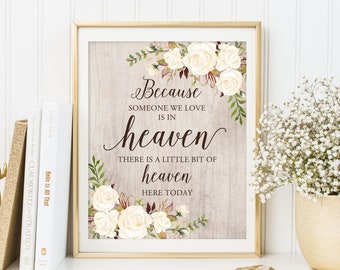 May include: A framed print with a floral design and the text "Because someone we love is in heaven, there is a little bit of heaven here today."