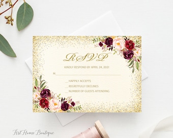 May include: Gold glitter RSVP card with a floral design featuring burgundy, pink, and green flowers. The text reads "RSVP" in gold script and "Kindly respond by April 24, 2021".