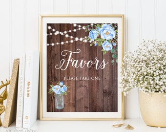 May include: A rustic wooden sign with blue flowers and string lights, reading "Favors Please Take One".