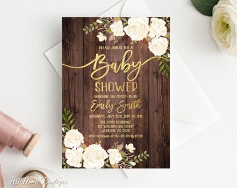 May include: A rustic wooden background with white roses and greenery. The text "Please join us for a Baby Shower" is written in gold script. The text "Honoring the mommy-to-be Emily Smith" is written in gold. The date and time of the shower are listed below, along with the address and RSVP information.