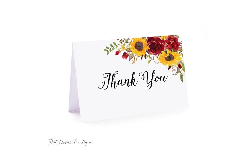 K&ouml;nnte beinhalten: Wei&szlig;e Dankeskarte mit einem floralen Design mit roten und gelben Blumen. Der Text "Danke" ist in schwarzer Kursivschrift gedruckt.