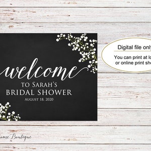 May include: A black sign with white script that reads "welcome to Sarah's Bridal Shower August 18, 2020." The sign is decorated with white floral accents and the text "Digital file only! You can print at local or online print shop."