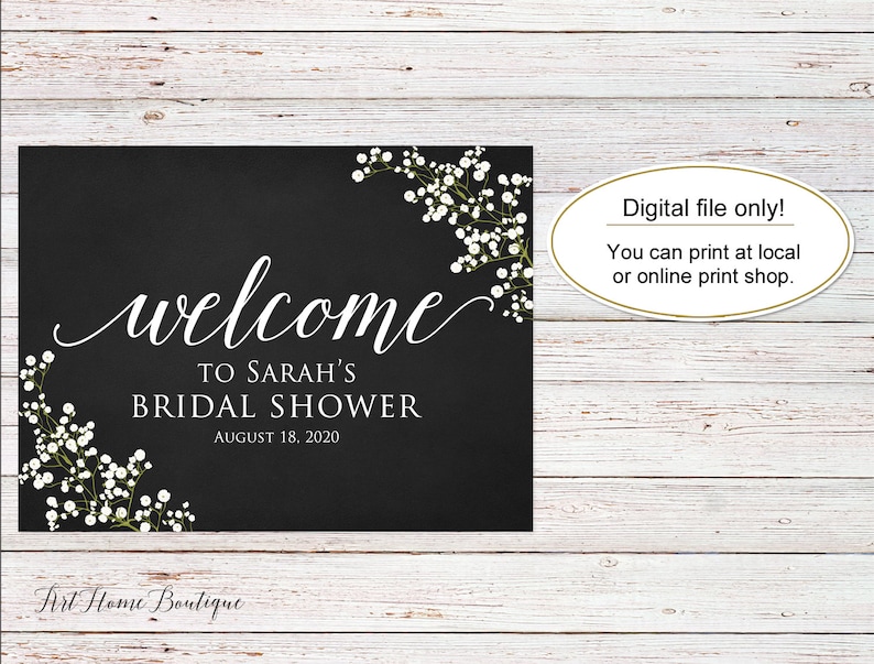 May include: A black sign with white script that reads "welcome to Sarah's Bridal Shower August 18, 2020." The sign is decorated with white floral accents and the text "Digital file only! You can print at local or online print shop."