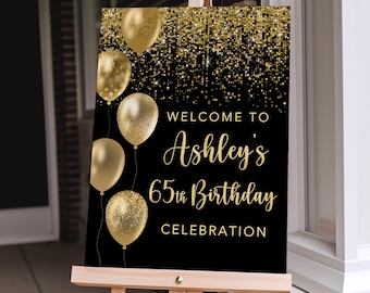 May include: Black and gold welcome sign with gold balloons and glitter. The sign reads "Welcome to Ashley's 65th Birthday Celebration".