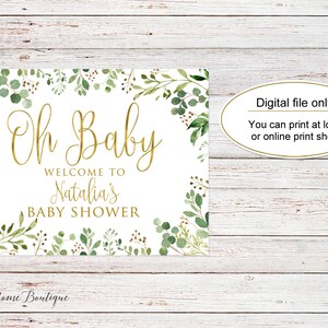 May include: A printable baby shower sign with a white background and green foliage border. The text reads "Oh Baby Welcome to Natalia's Baby Shower".