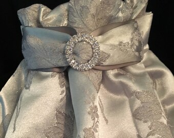 Bridal brocade in a whisper soft lavender with gold embroidery with gray and rhinestone tab