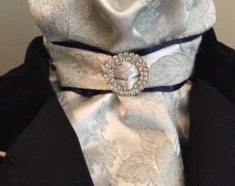 Bridal brocade in pale blue/gray satin and metallic embroidery with navy and rhinestone tab