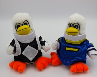 Blue and Black Ranger Cosplaying Penguin Plushies White Penguins in Blue and Black Costumes