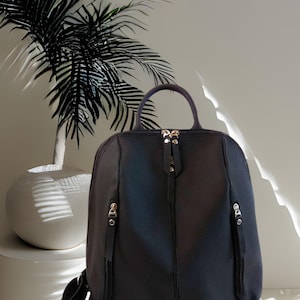 Black women&#39;s leather backpack of medium size Casual office bag college backpack