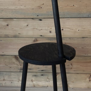 Custom made round solid Oak Table with integrated handle for ease of handling and can be used to hang lights with scorched surface finish