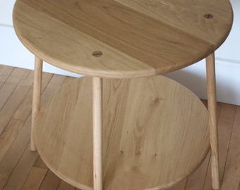 Handmade round table made in solid European Oak with lower shelf and turned straight legs with visible tenon joints and visible peg joints