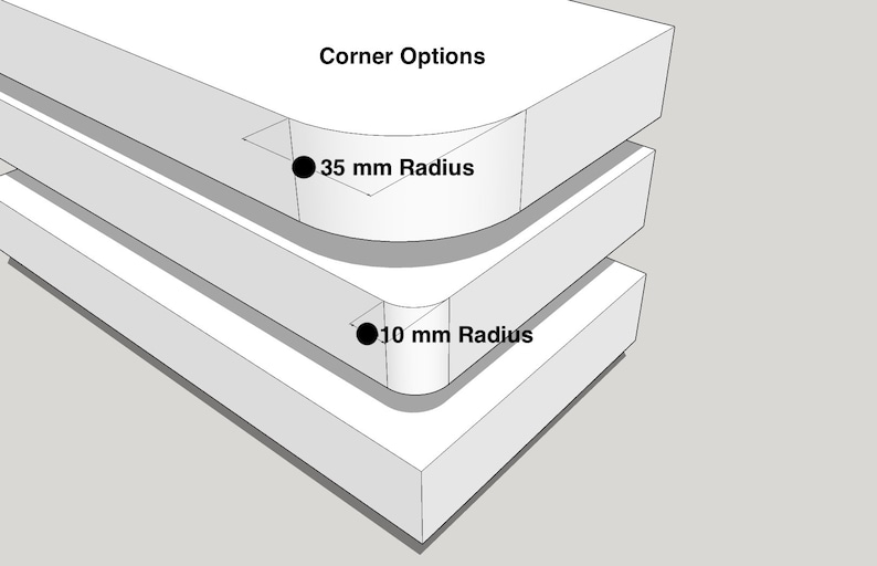 May include: A white 3D diagram titled Corner Options showing two stacked rectangular blocks. The top block features a 35 mm radius corner, while the bottom block features a 10 mm radius corner, both clearly labelled with black text and dots.