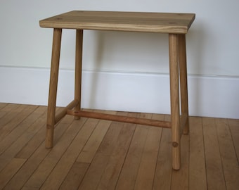 Handmade solid oak table with turned legs and supporting cross members secured that are fixed into position with contrasting wedged tenons