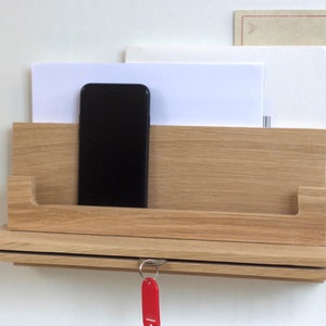 Custom made solid Oak wall mounted organiser with key holder, letter rack, phone and shelf storage finished in beeswax and concealed fixings